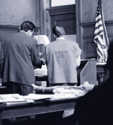 Counsel and client in courtroom
