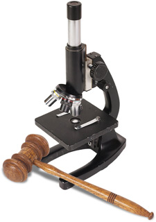 Image of a microscope and a judge's gavel