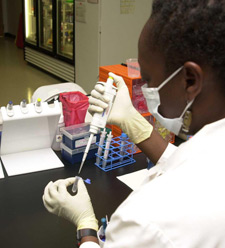 Image of a scientist in a lab doing a test