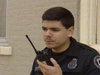 Image of policeman using radio