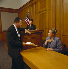 Photo in a courtroom where an expert is being interviewed
