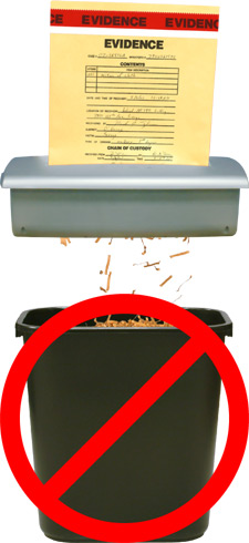 Photo of evidence folder being put into a paper shredder with a red circle with a diagonal cross through it over top 