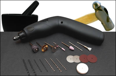Photo of specialized tools for extraction procedures, including a hammer and Dremel tool