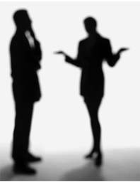 Photo of man and woman conversing in silhouette