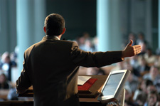 Photo of man presenting to an audience