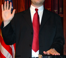 Photo of individual getting sworn in to testify