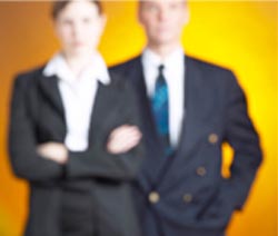 Photo of man and woman in professional business attire
