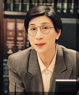 Photo of a female attorney in a law library