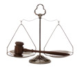 Photo of a set of scales with a judge's gavel