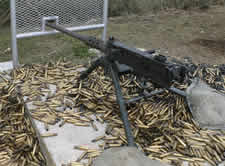 Photo of a Machine gun on a pile of bullets
