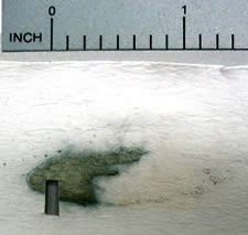 An ammonium hydroxidelift of a ricochet mark sprayed with DTO reagent