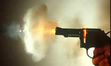 Revolver firing showing residues and bullet exiting