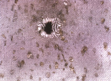 Residues surrounding a bullet hole