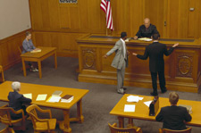 two lawyers arguing in front of a judge