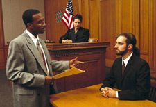 A lawyer talking to a witness in court