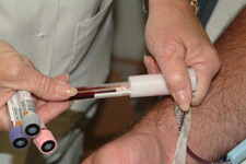 Photo of blood being drawn from someone's arm