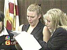 Photo of a victim crying while reading a statement in court