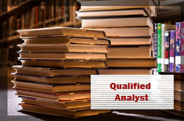 Photo of a law books stacked in two piles. Front caption says 'Qualified Analyst'