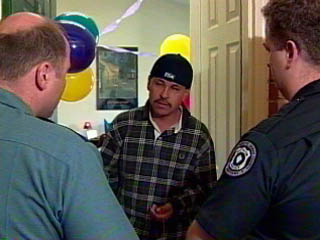 Photo of officers responding to a house where a party is occurring