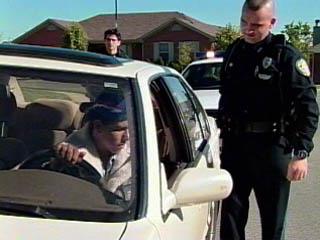 Photo of Officer Murphy initiating a traffic stop after observing a car swerving.