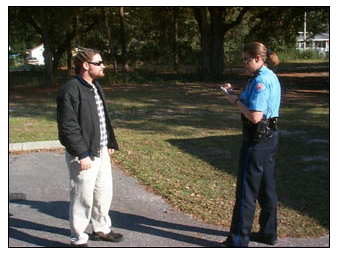 Photo of officer talking to man