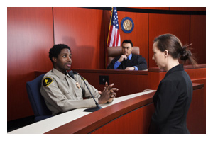 Officer being interviewed in courtroom