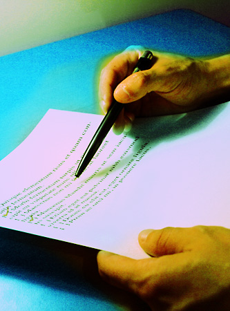 Photo of hands going over a checklist on paper