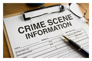 clipboard with paper that says crime scene information 