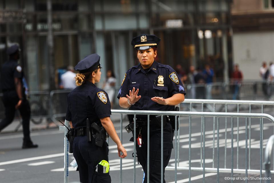 Two women police officers talking while on duty. 