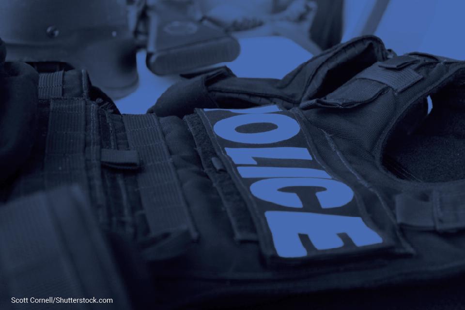 Photo of chest body armor with the word "Police" on it
