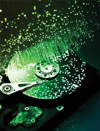 Computer hard disk with light pellets bouncing off of it.