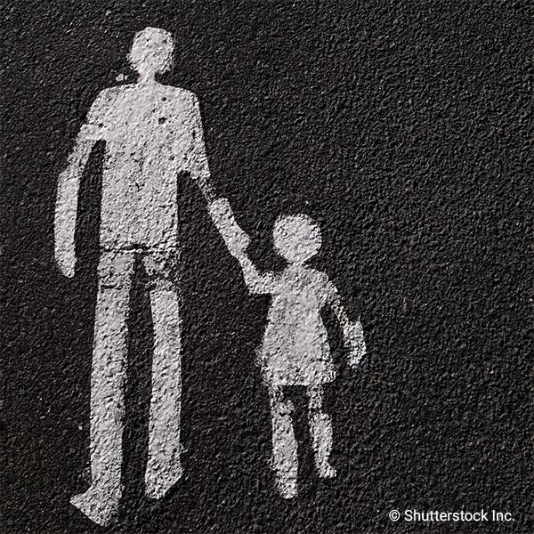 Simple drawing of adult and child holding hands