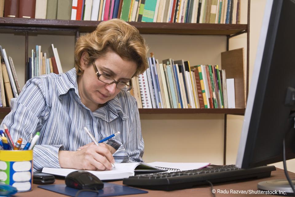 Woman writing in a notebook