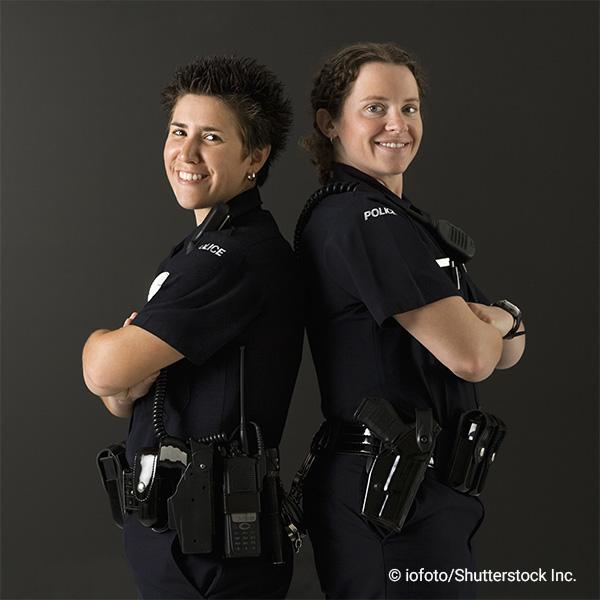 two female officers standing back-to-back