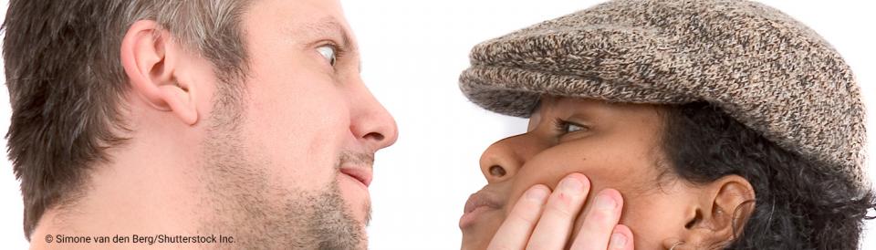 man grabbing a woman's face