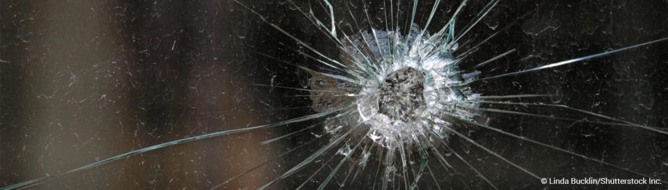 Glass with bullet hole