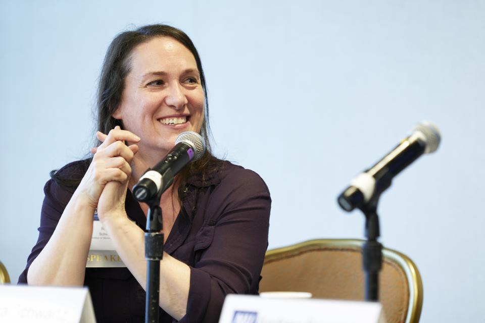 Reva Schwartz listens to fellow presenters taking part in the panel "Artificial Intelligence: Improving Criminal Justice Efficiencies and Mitigating Biases" at the NIJ 2023 Research Conference