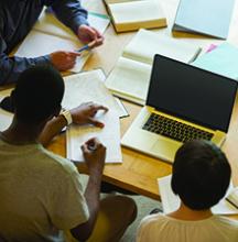 Two students working on a paper