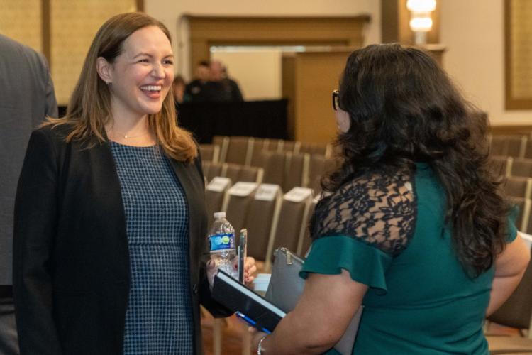 Erin McBride, Bode Technology's Vice President of Forensic Operations, chats to a conference attendee