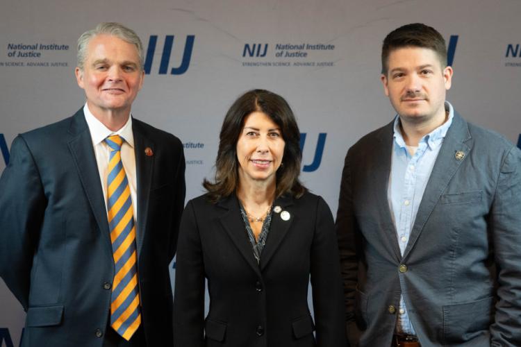 NIJ Director Nancy La Vigne takes selfies with conference attendees