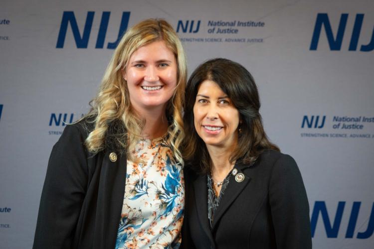 NIJ Director Nancy La Vigne takes selfies with conference attendees