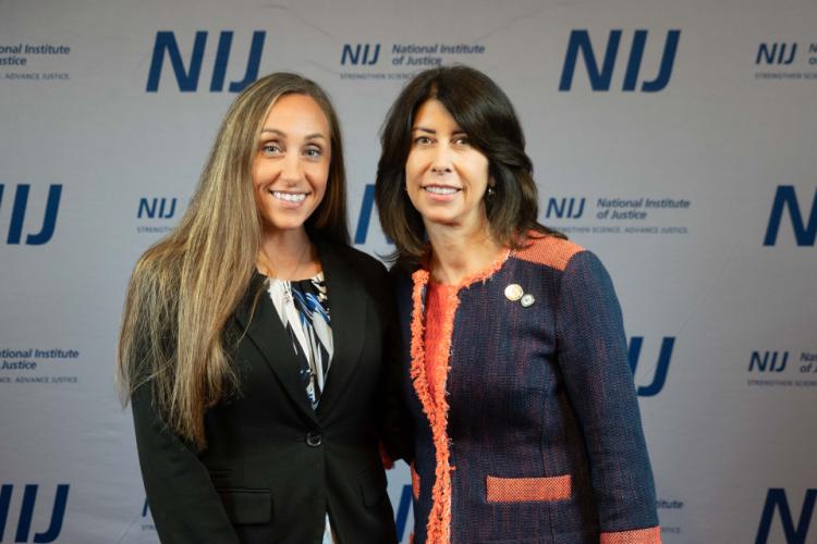 NIJ Director Nancy La Vigne takes selfies with conference attendees