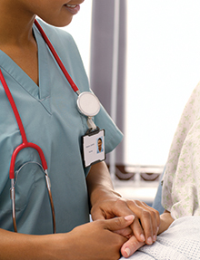 Nurse Holding Patient Hand