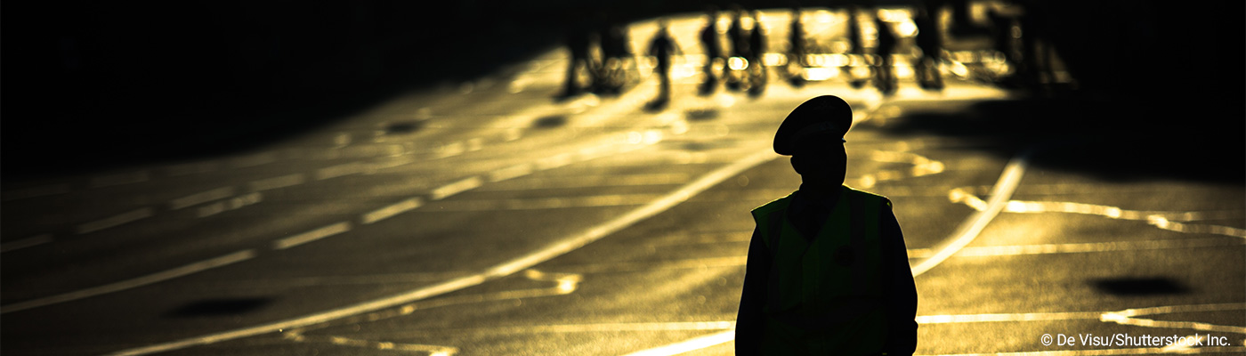 police officer standing in a roadway