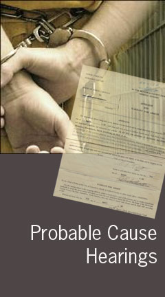 Photo of a man's hands in cuffs. Caption says 'Probably Cause Hearings'