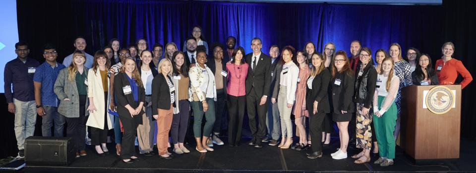 Student attendees at the NIJ 2023 Research Conference pose with NIJ Director Nancy La Vigne and BJS Director Alex Piquero