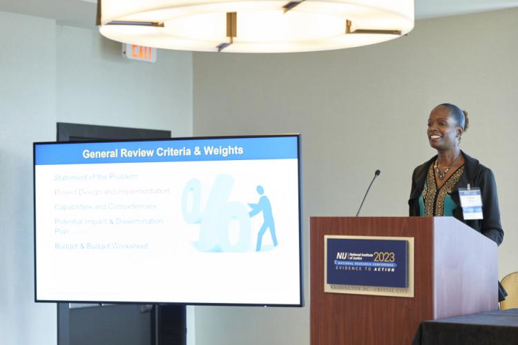 NIJ's Dr. Angela Moore moderates the panel "Unlocking the Mysteries: Securing Funding and Support From the U.S. Department of Justice’s Two Science Agencies" at the NIJ 2023 Research Conference