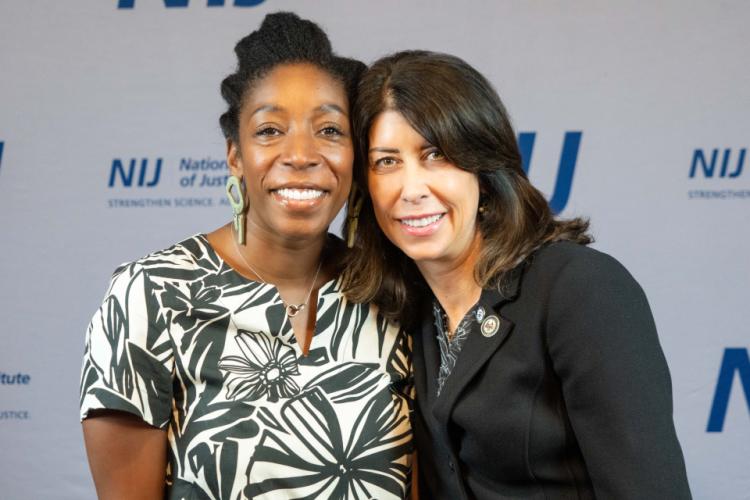 NIJ Director Nancy La Vigne takes selfies with conference attendees